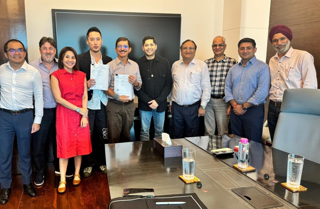 Bryan Loo proudly displays the franchise agreement with DIL President & CEO Virag Joshi (right). From Joshi’s left are Non-Executive Director Varun Jaipuria and members of the DIL senior management team. With Loo (from left) are Loob Strategy & Portfolio Director Jeremy Tan, Loob adviser Troy Franklin and Loob Financial Controller Quah Seik Lee.