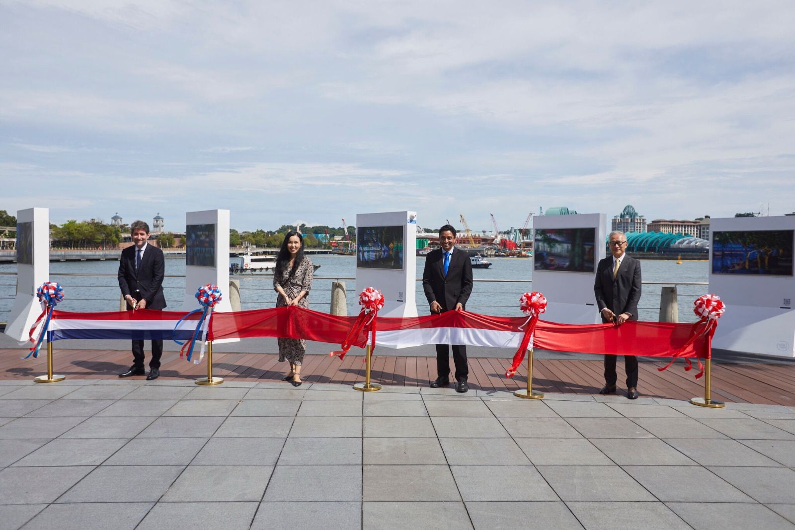 (From left) His Excellency Mr Stephen Marchisio, Ambassador of France to Singapore; photographer Melisa Teo; Guest-of-Honour Mr Dinesh Vasu Dash, Minister of State for Culture, Community and Youth, and Manpower; and Mr Edmund Cheng, Chairman, Mapletree at the ribbon-cutting ceremony for Two Rivers (Part II) photography exhibition at VivoCity’s waterfront Promenade.